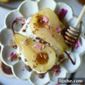 Velvet Vanilla Pears with Creamy Yogurt 8 Overhead of poached pears in a flower plate with rose petals on top.