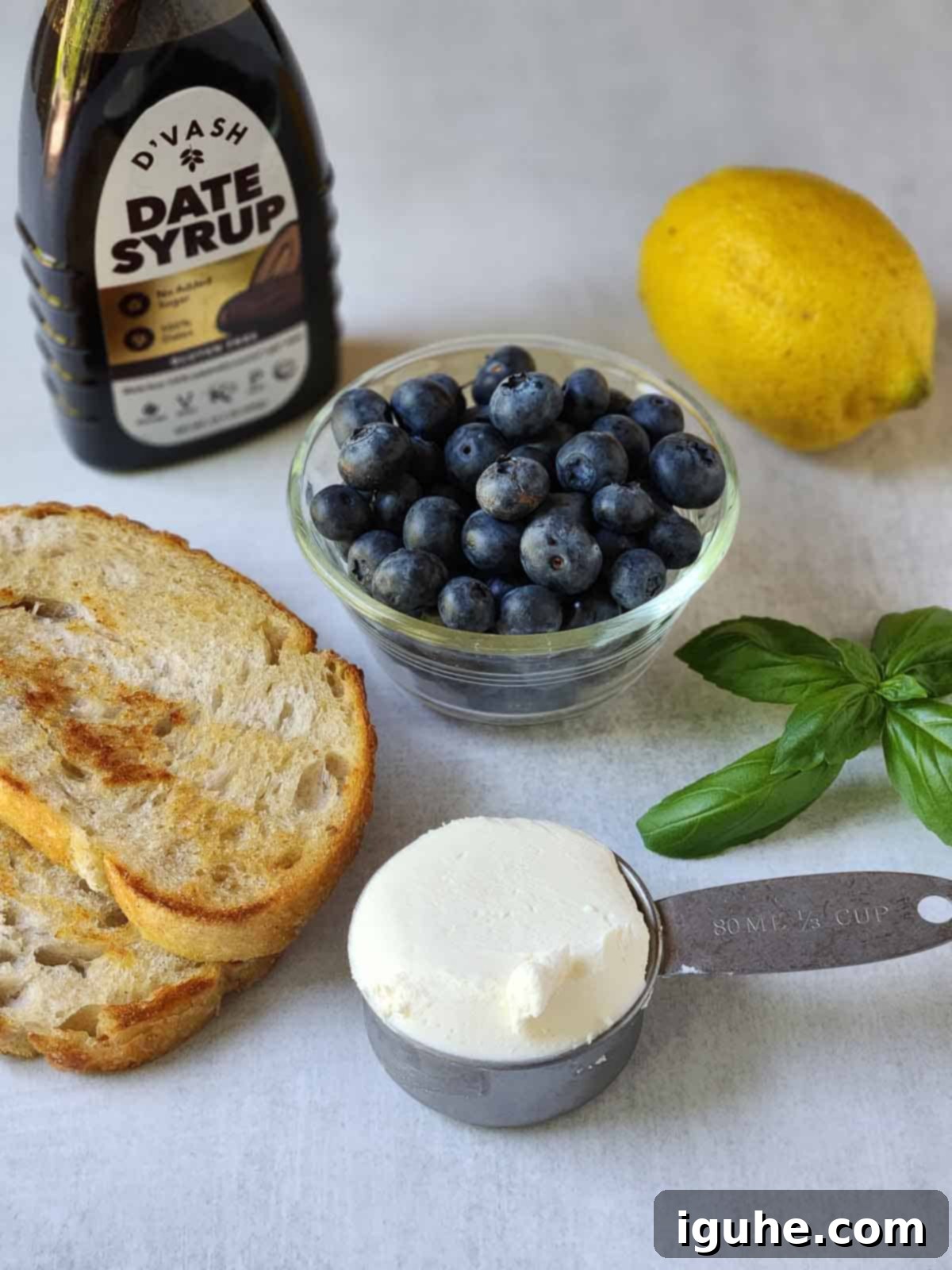 Blueberry Bliss Toast 3 Ingredients for blueberry toast on a grey surface.