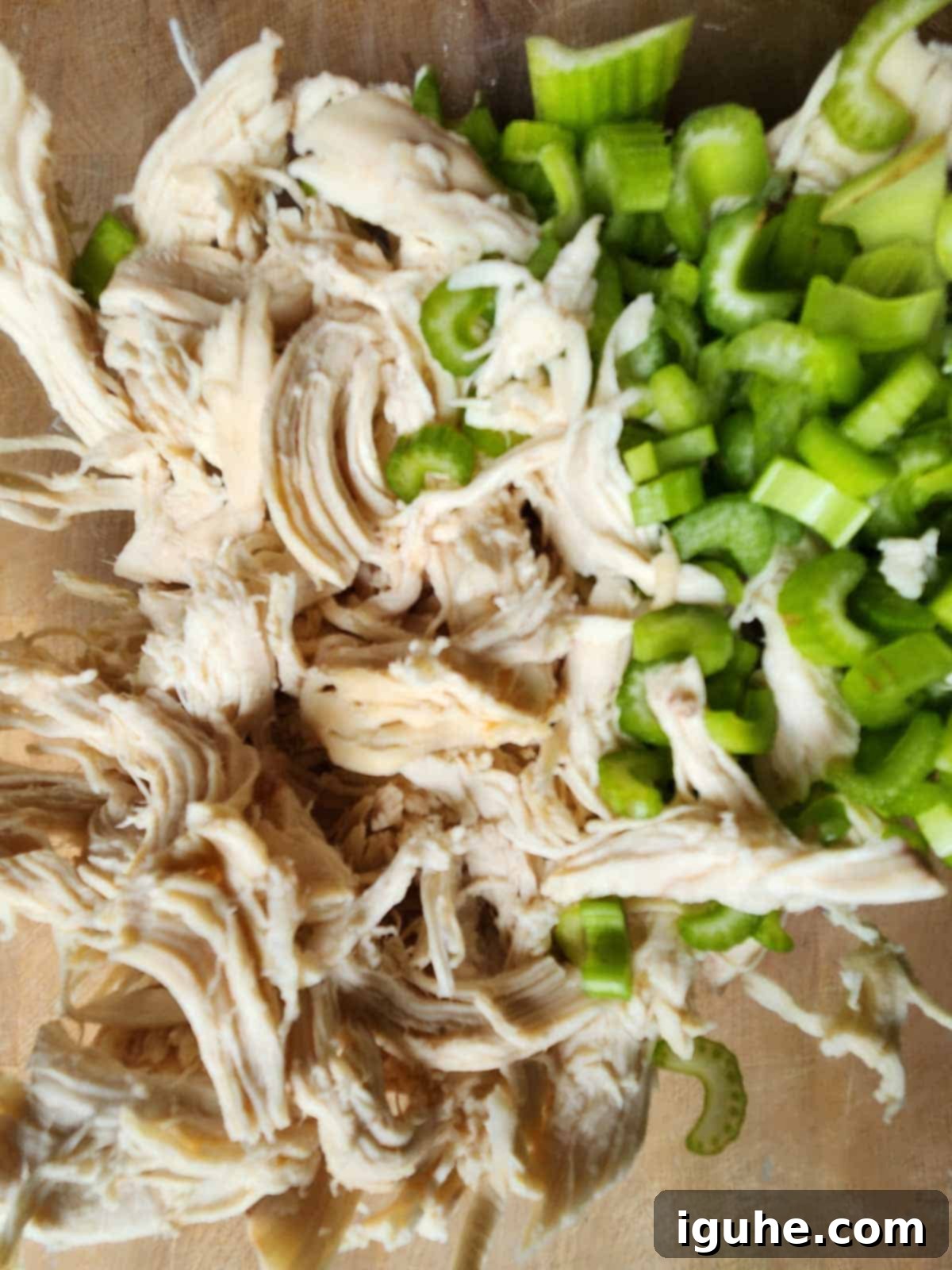 Roasted Grape Rotisserie Chicken Salad 6 Chicken and chopped celery in a bowl.