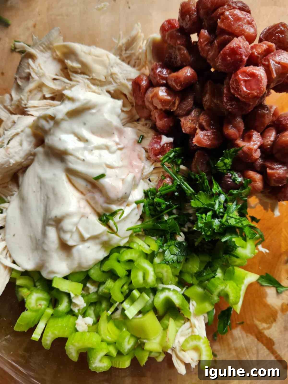 Roasted Grape Rotisserie Chicken Salad 8 Ingredients for chicken salad in a bowl.