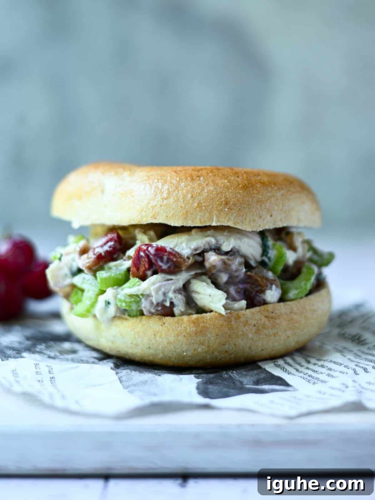 Roasted Grape Rotisserie Chicken Salad 10 Chicken salad with grapes on a bagel.