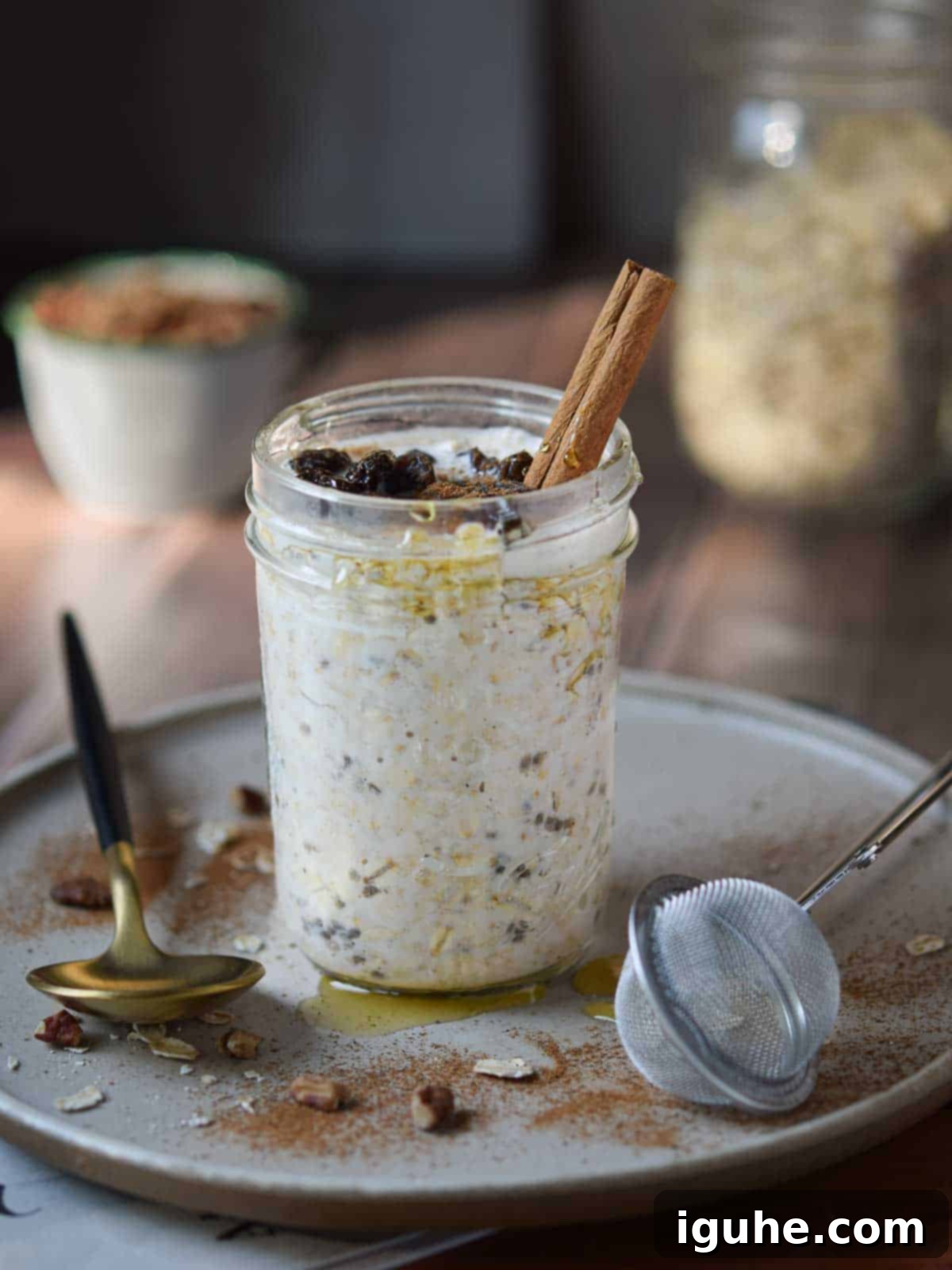 Creamy Maple Raisin Overnight Oats 8 Overnight oats in a jar with cinnamon and raisins.