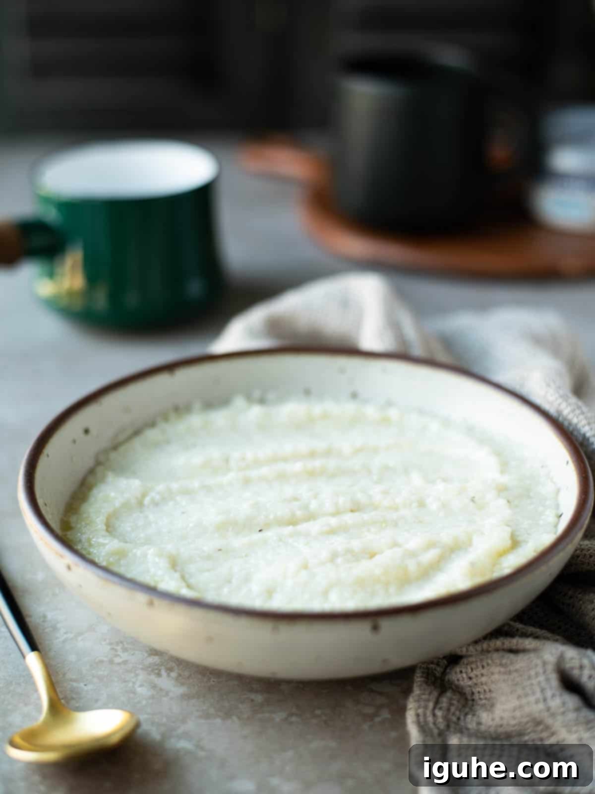 Creamy Everything Bagel Grits 5 Cream cheese grits in a beige bowl, perfectly smooth and creamy.