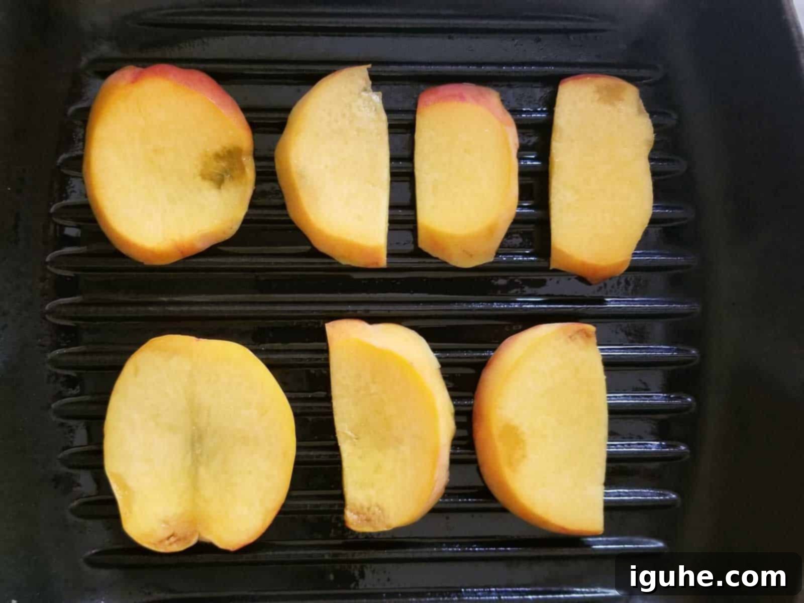 Caprese Toast with Grilled Peaches 4 Thinly sliced peaches on a cutting board