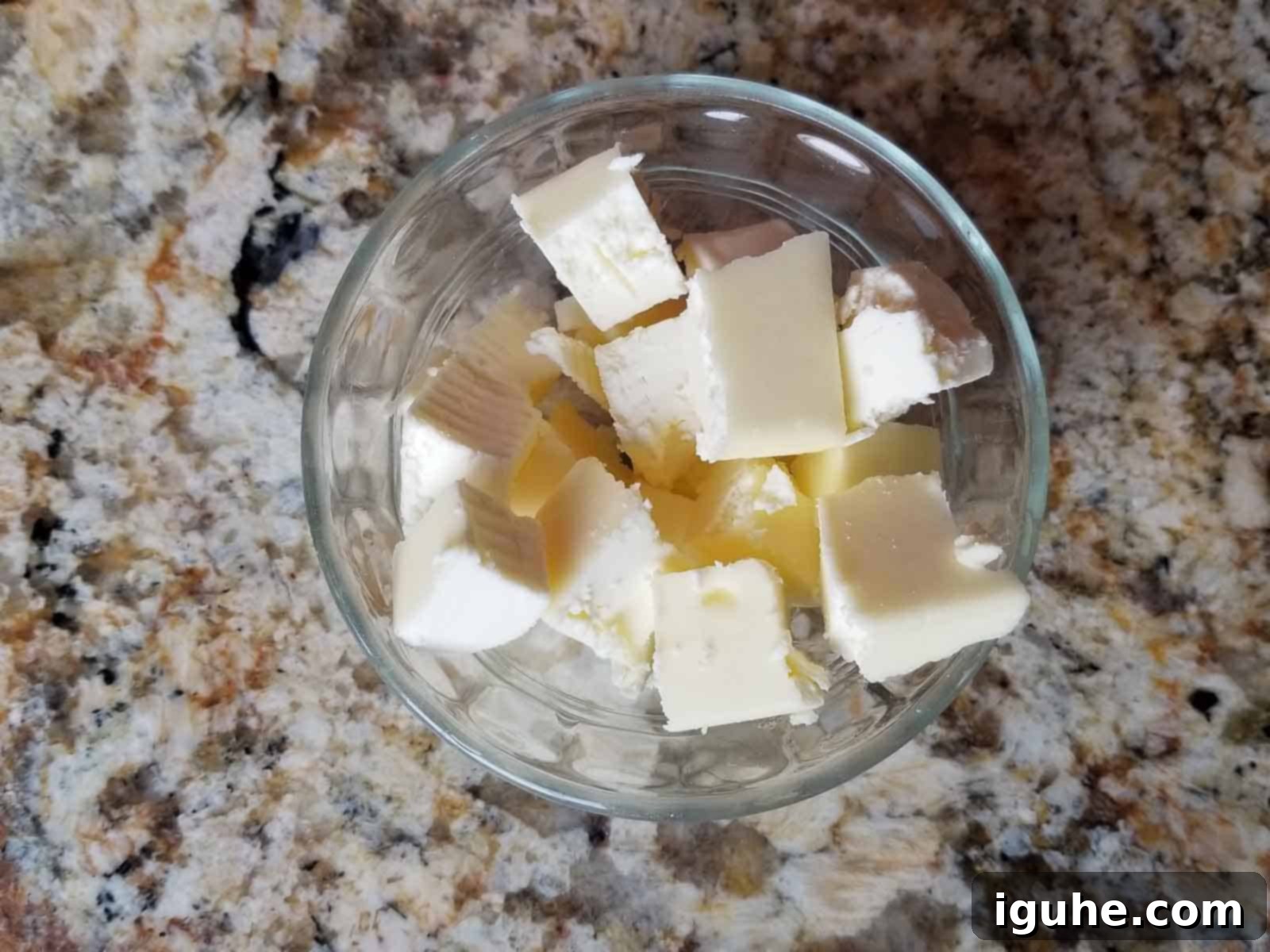 Golden Cheddar Sage Biscuits 4 Cubed cold butter in a clear bowl, ready to be added to flour.