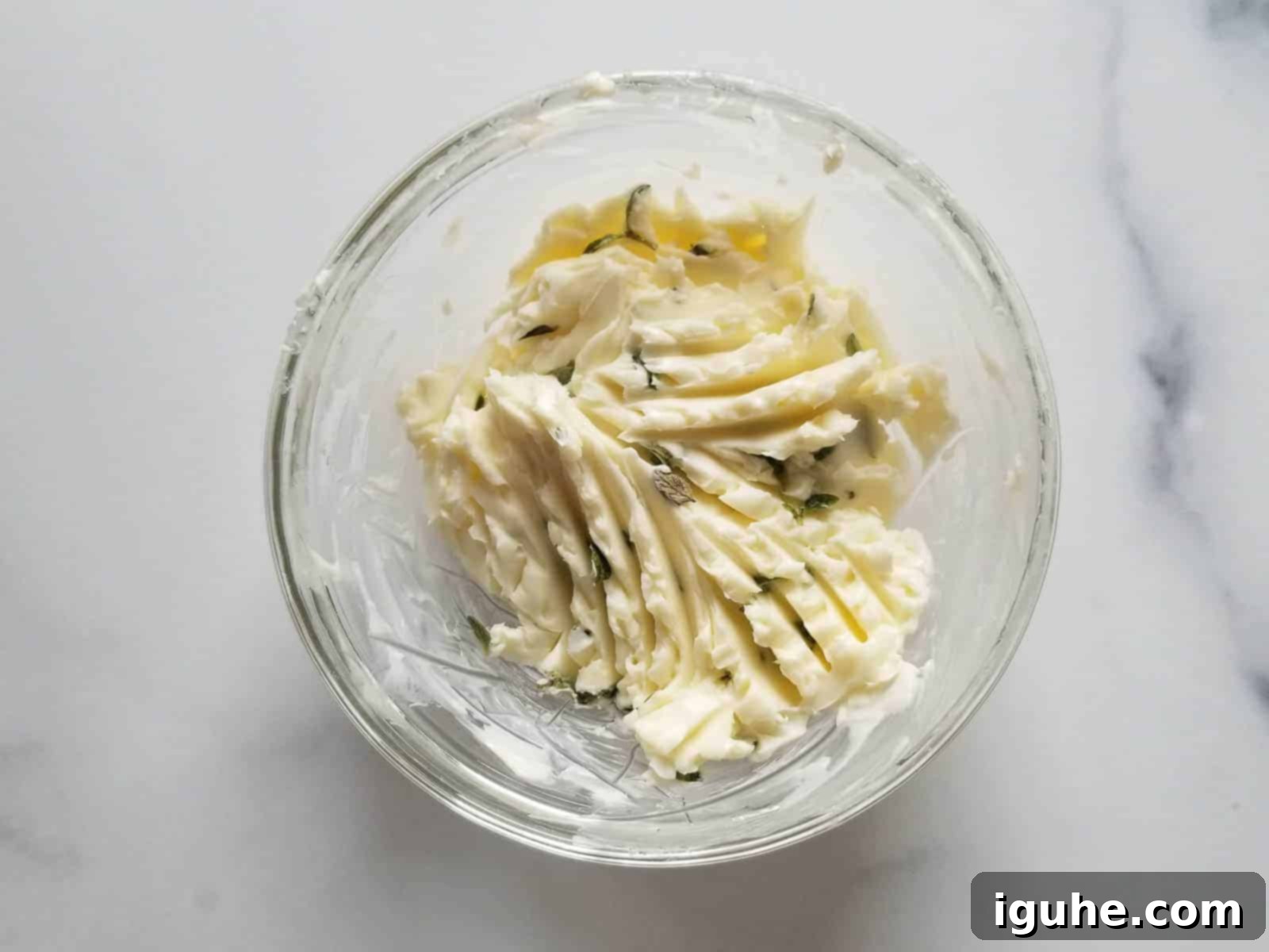 Sweet & Savory Gorgonzola Pear Melt 4 Softened butter mixed with fresh thyme in a small bowl.
