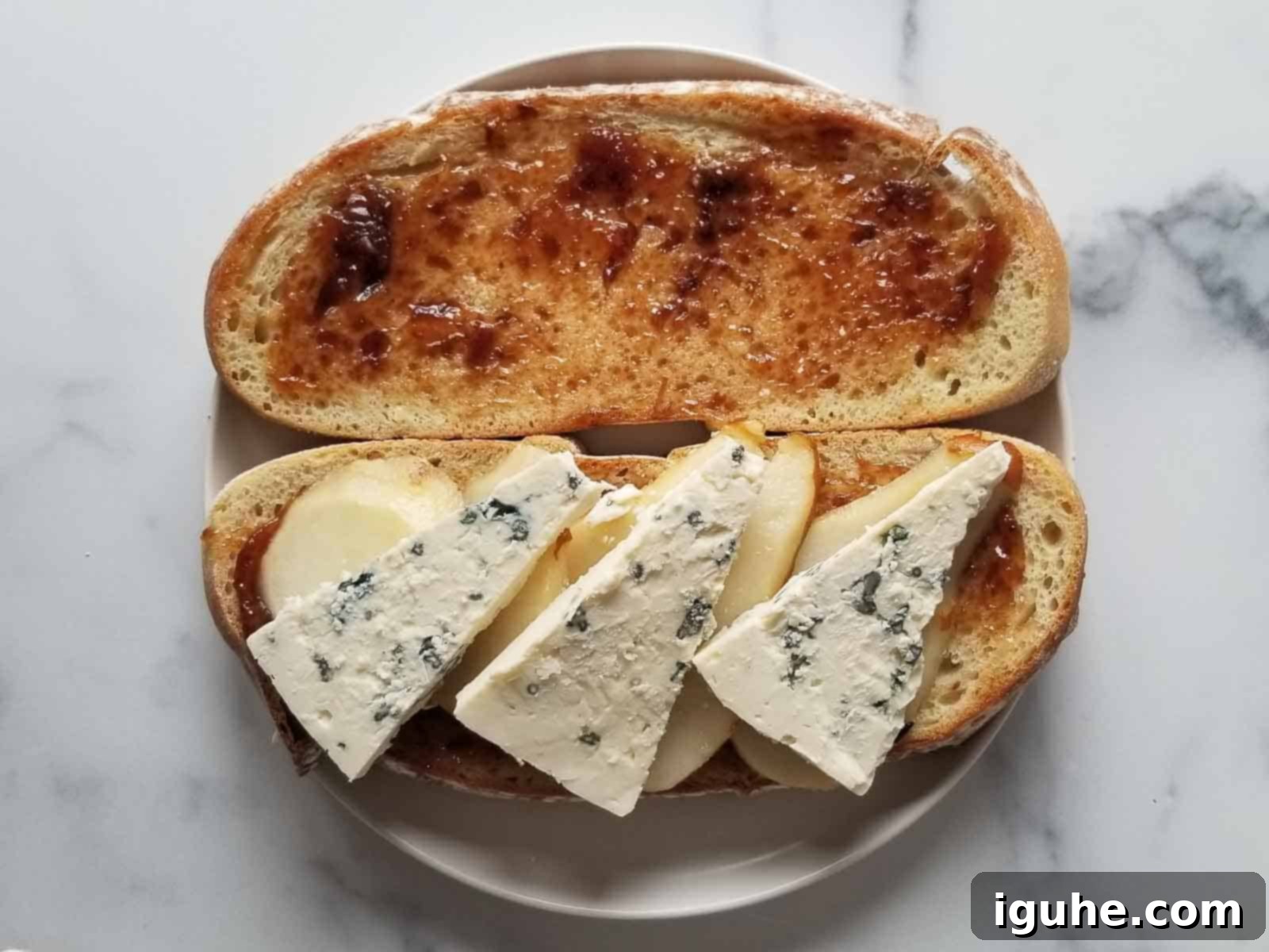 Sweet Pear and Pungent Gorgonzola Grilled Cheese 6 Bread prepared with fig jam, pears, and gorgonzola.