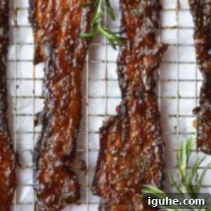 Sweet & Savory Fig-Rosemary Bacon 7 Candied bacon with rosemary on a wire rack.