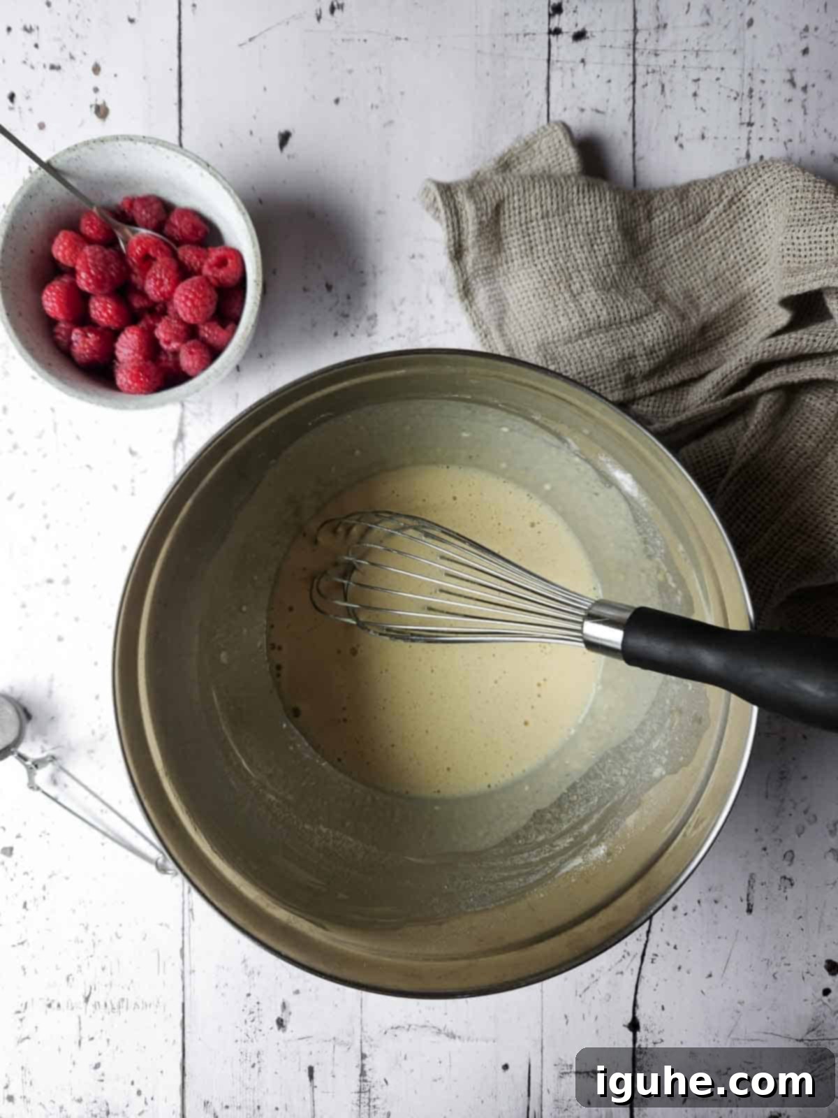 Vanilla Cloud Dutch Baby Pancake 4 Mixed batter for sweet vanilla Dutch Baby in a metal bowl.