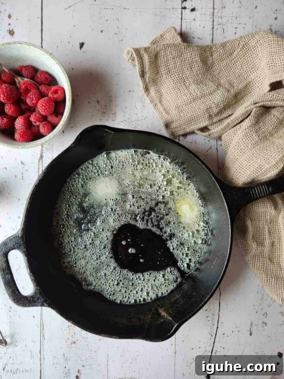 Vanilla Cloud Dutch Baby Pancake 5 Melted butter prepared in a hot cast iron skillet.