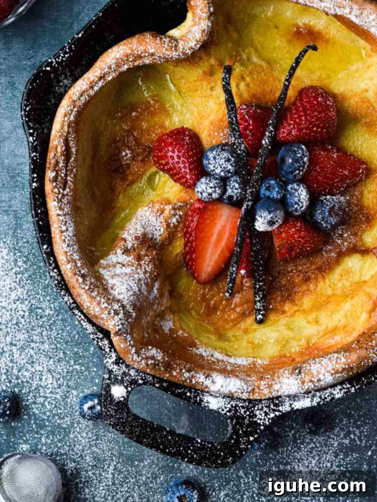 Vanilla Cloud Dutch Baby Pancake 8 Overhead picture of a vanilla Dutch baby with fruit in the middle.