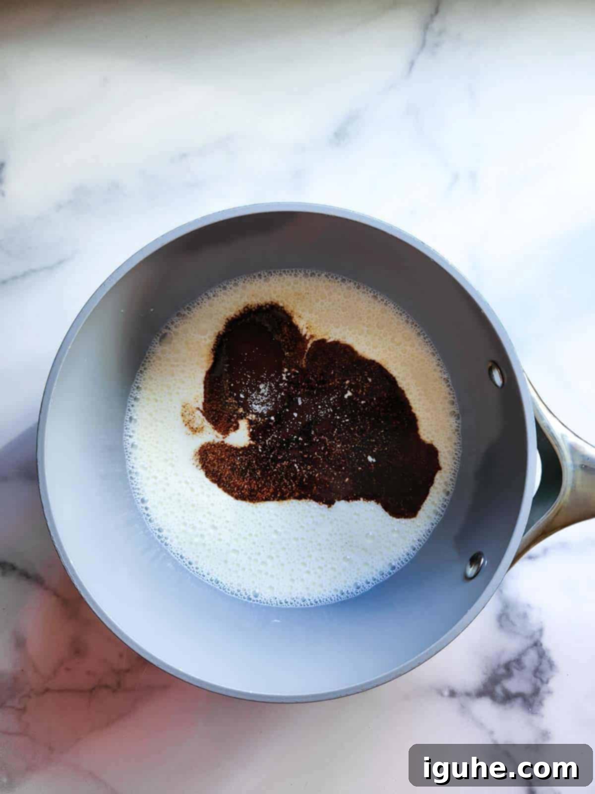 Velvet Espresso Panna Cotta 5 All ingredients for espresso panna cotta, including half and half, sugar, salt, and espresso powder, combined in a saucepan and gently heated on the stovetop.