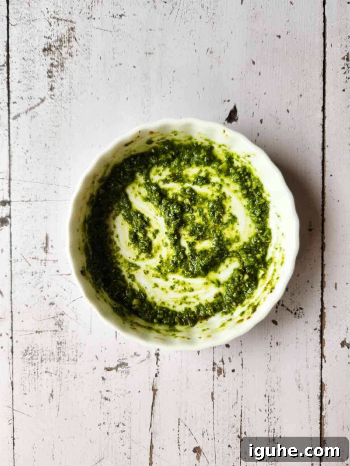 Pesto Egg Bake 4 Pesto sauce in a white ramekin.