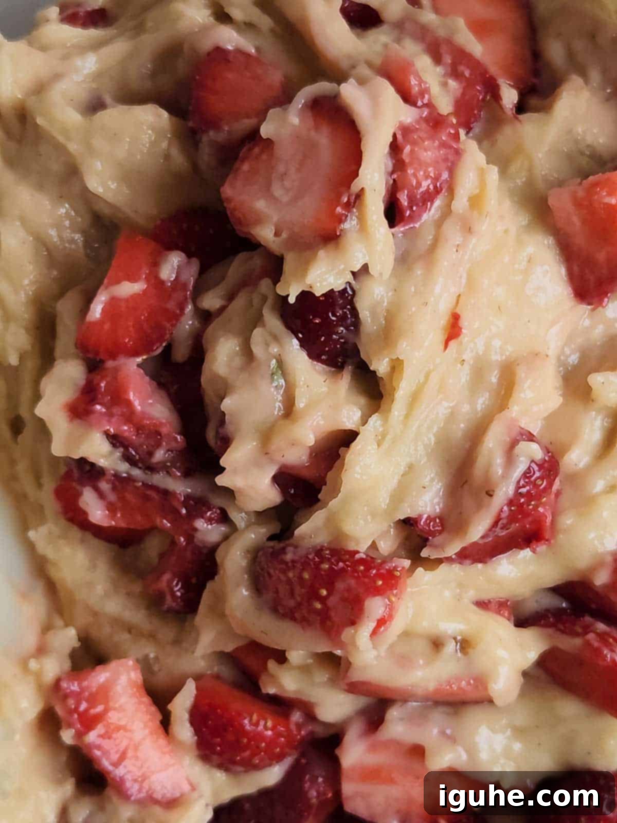 Buttermilk Kissed Strawberry Loaf 6 Diced fresh strawberries being gently folded into the quick bread batter.