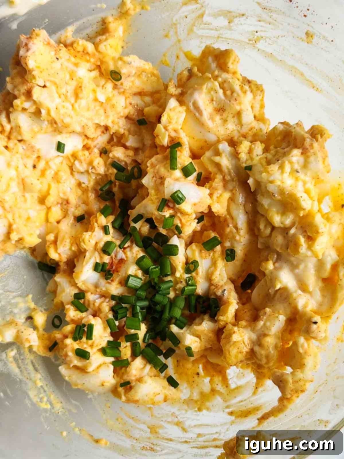 Smoky Paprika and Fresh Chive Egg Salad 7 The finished smoked paprika and chives egg salad, perfectly mixed in a bowl, ready to be enjoyed.