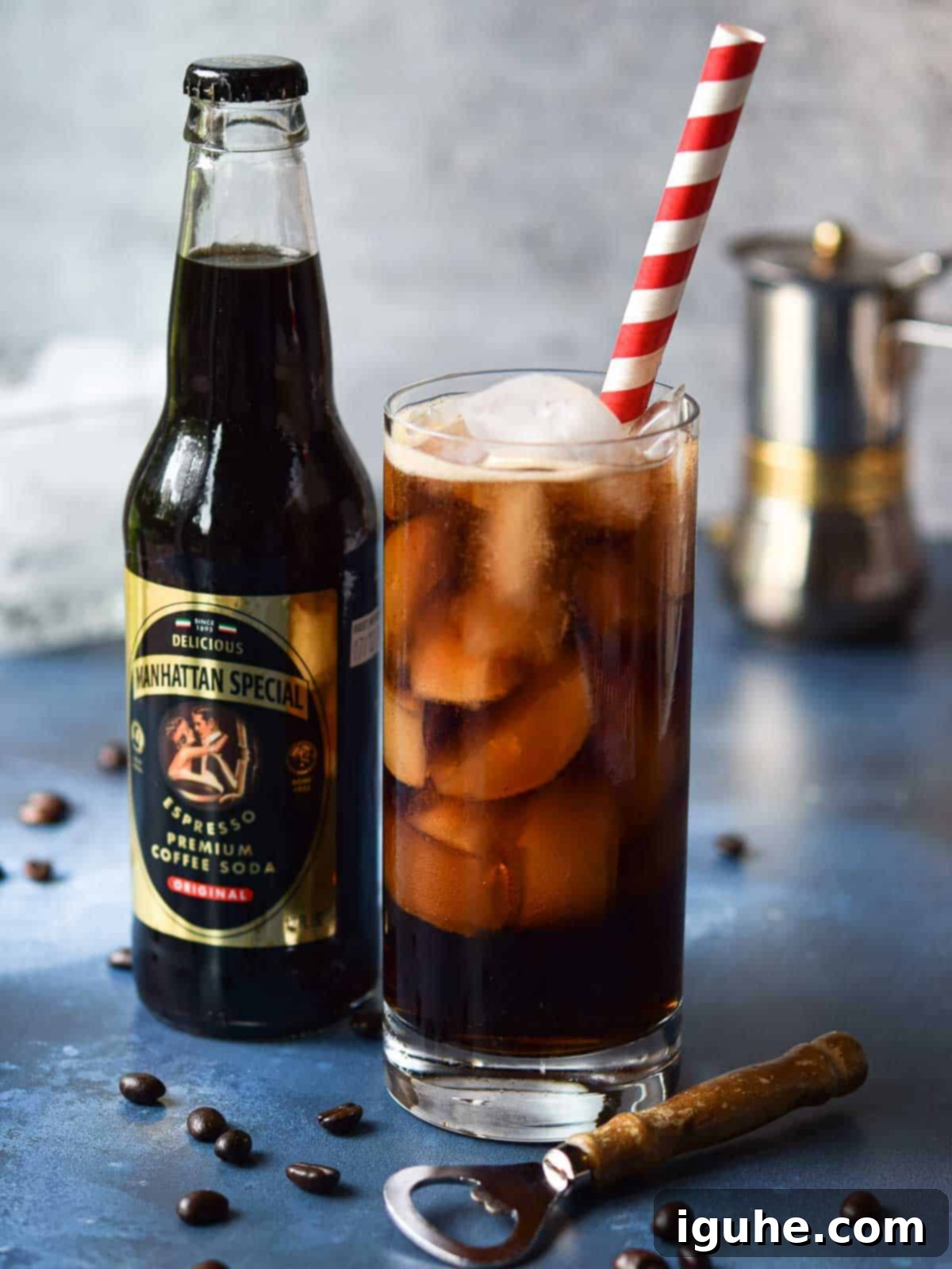 Espresso Sparkle 5 Homemade espresso soda in a glass next to a bottle of Manhattan Special, highlighting the comparison.