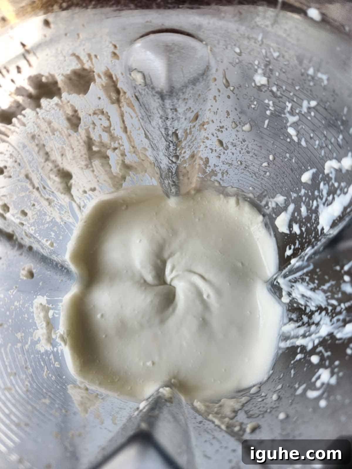 Creamy Cottage Cheese Breakfast Bowls 5 The smooth, creamy consistency of whipped cottage cheese visible inside a blender after being processed, ready to be served.