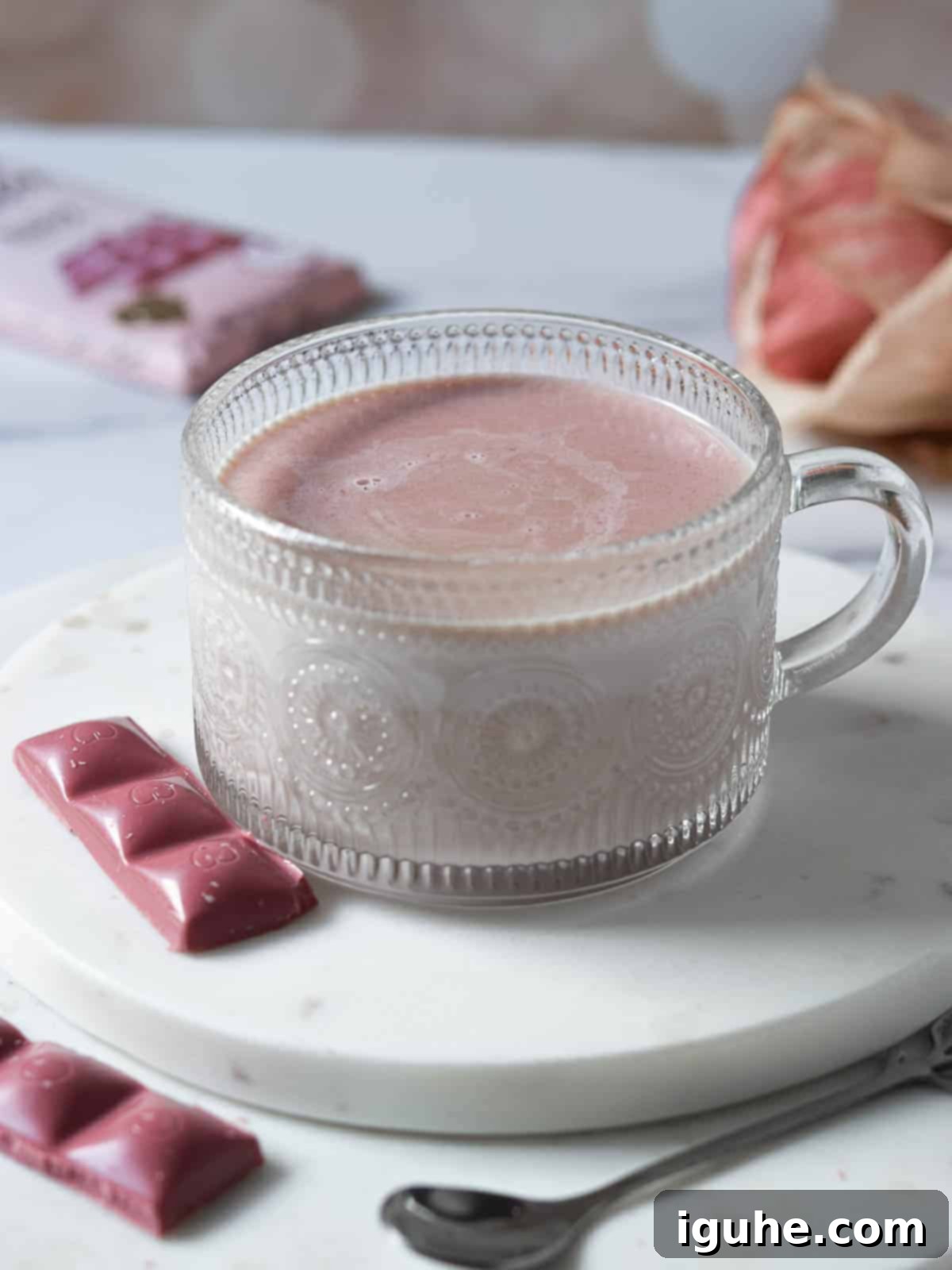 Velvet Ruby Hot Cocoa 6 Ruby hot chocolate being poured into an elegant clear etched mug.