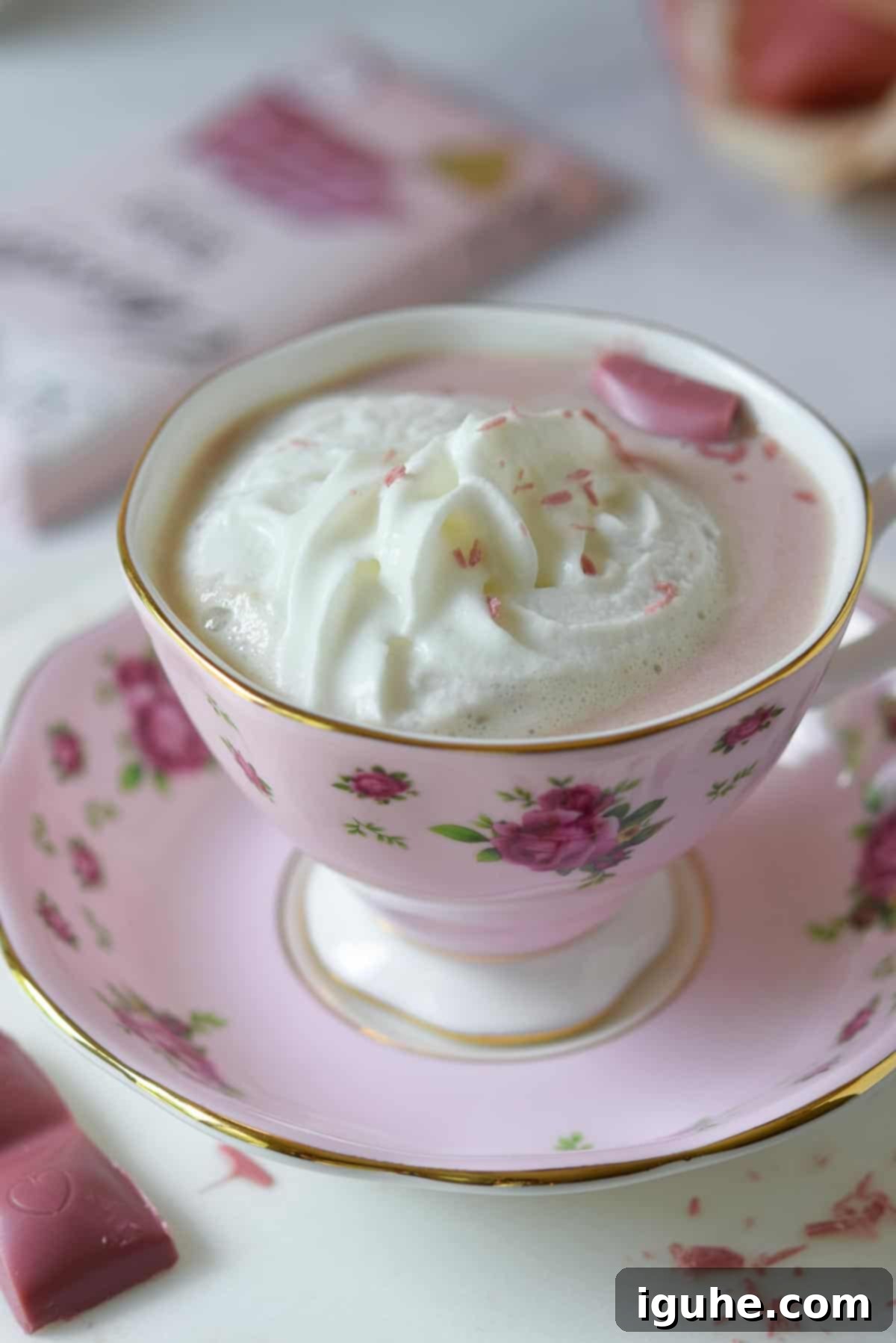 Velvet Ruby Hot Cocoa 9 Overhead view of pink hot chocolate with whipped cream and chocolate shavings.
