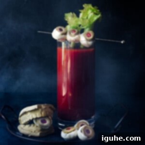 Halloween's Bloody Scary Mary 9 Bloody Mary with celery and mozzarella garnish on a black background.