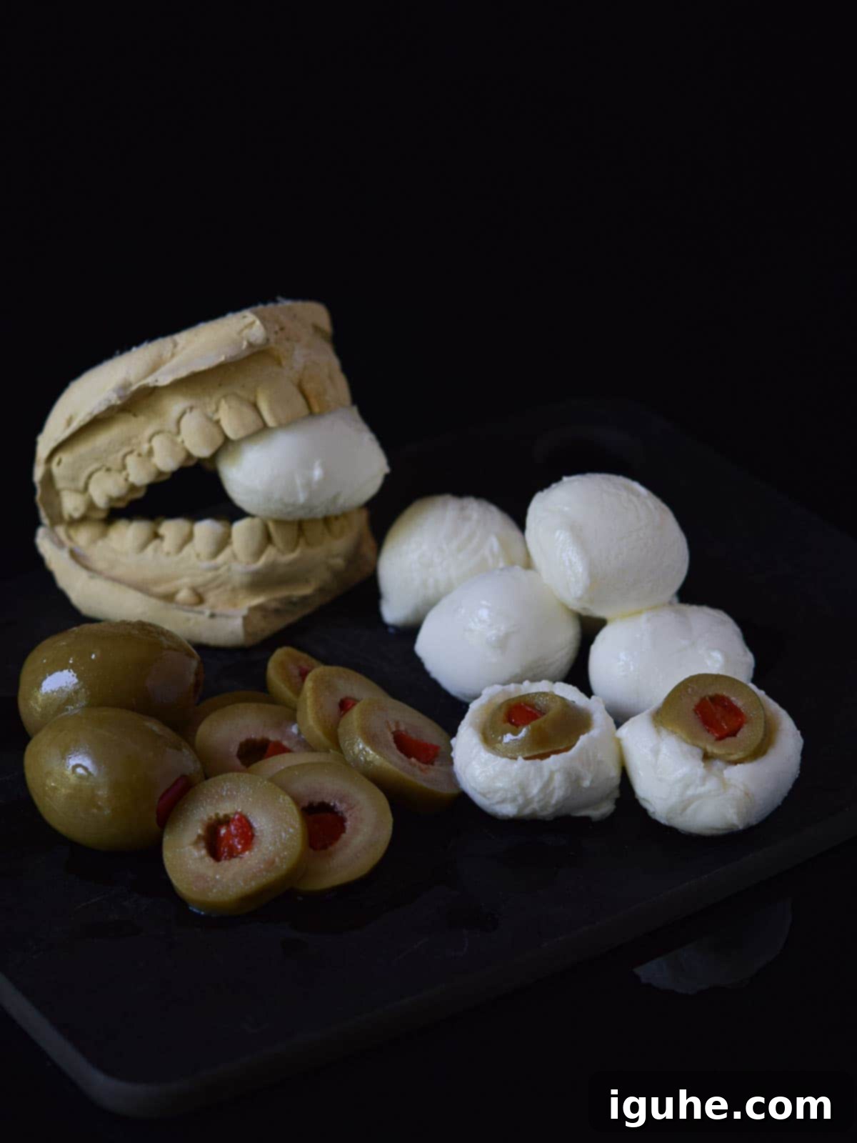 Halloween's Bloody Scary Mary 5 A mozzarella ball with an olive slice carefully inserted into the scooped-out hole, resembling a realistic eyeball.