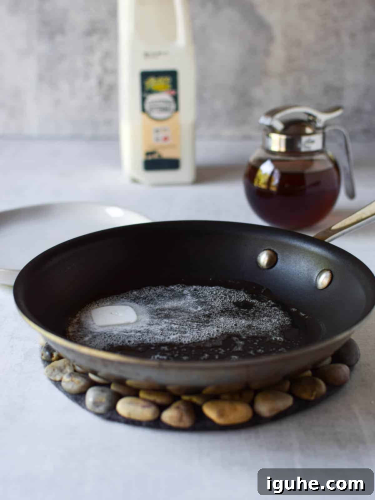 Repurposed Buttermilk French Toast 8 Melted butter sizzling in a non-stick frying pan.