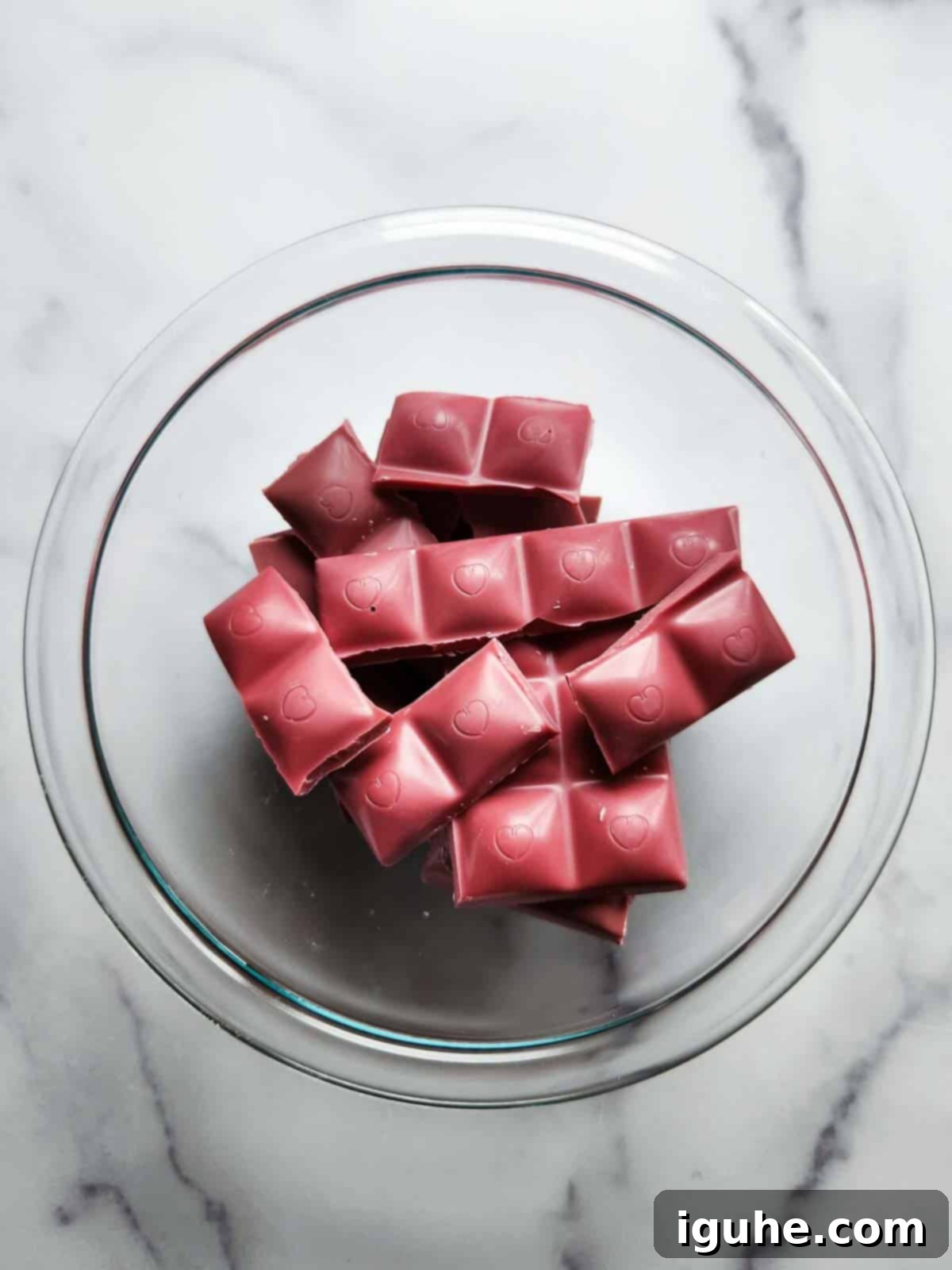Blush Ruby Chocolate Bark 4 Chopped up pink chocolate in a bowl.