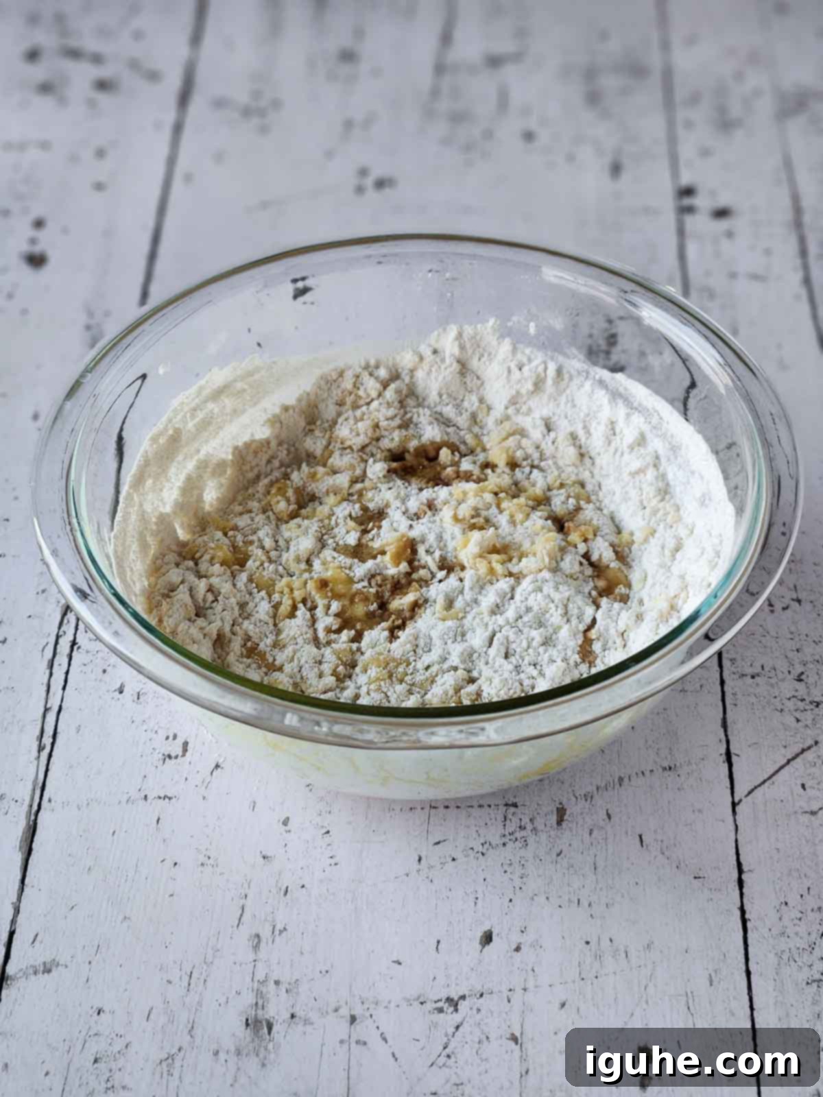 Effortless Lemon Pizzelle 6 Flour and egg mixture in a clear bowl.