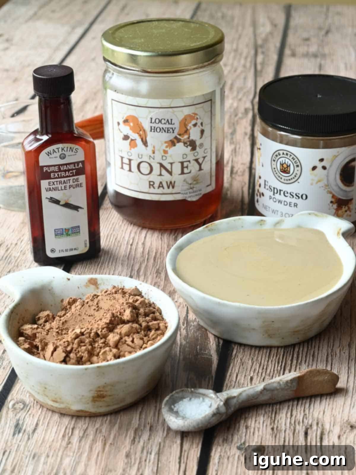 Ingredients for chocolate tahini spread on wood.