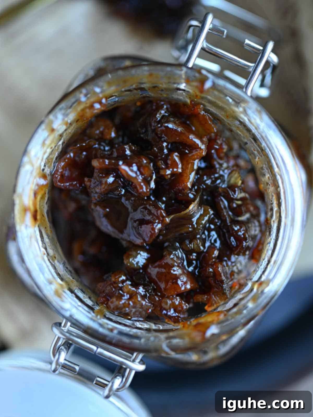 Bourbon-Kissed Bacon Bliss 8 Overhead of bacon bourbon jam in a glass jar.