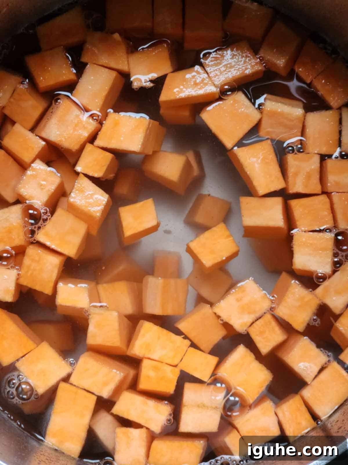 Sunrise Sweet Potato Bacon Medley 4 Diced sweet potatoes in a pot of water.