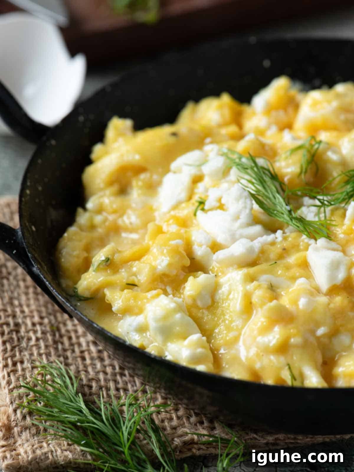 Mediterranean Feta Dill Scramble 9 Close up of scrambled eggs in a black skillet.