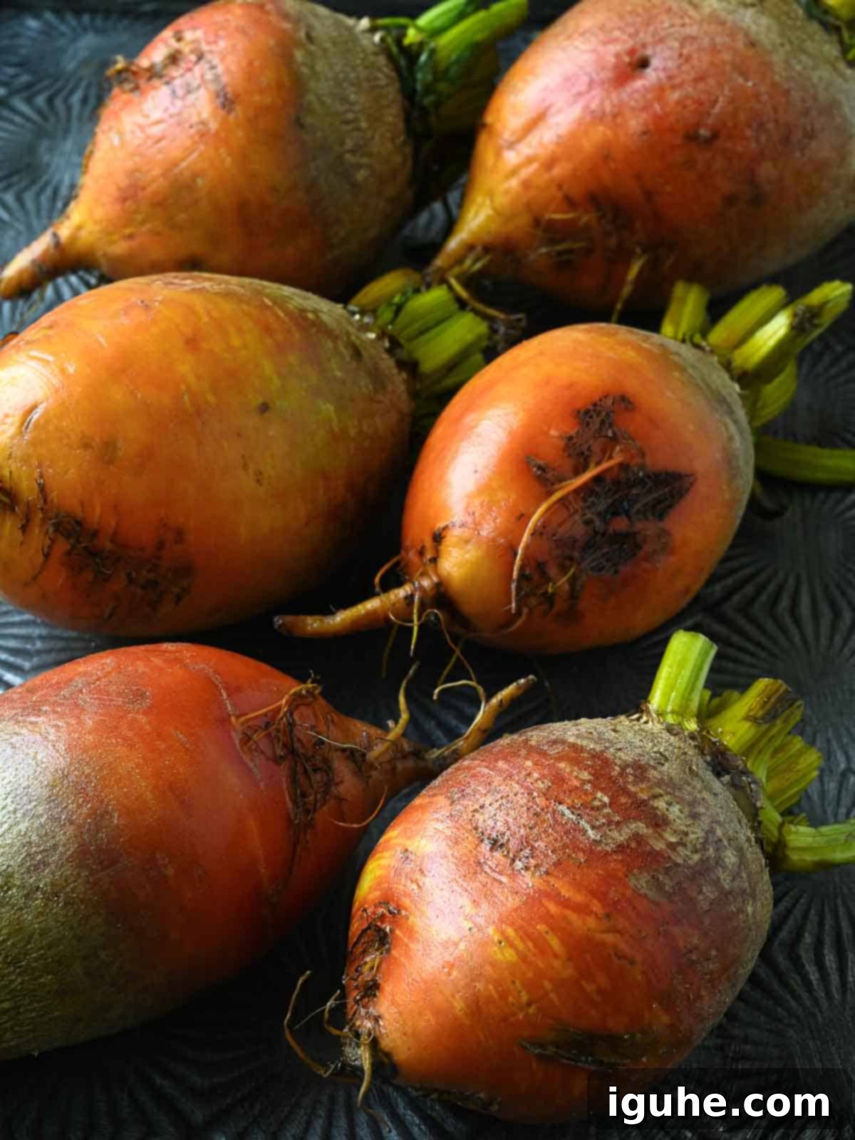 Aromatic Golden Beet Salad with Tarragon Vinaigrette 4 Washed yellow beets on a metal baking tray, ready for roasting.