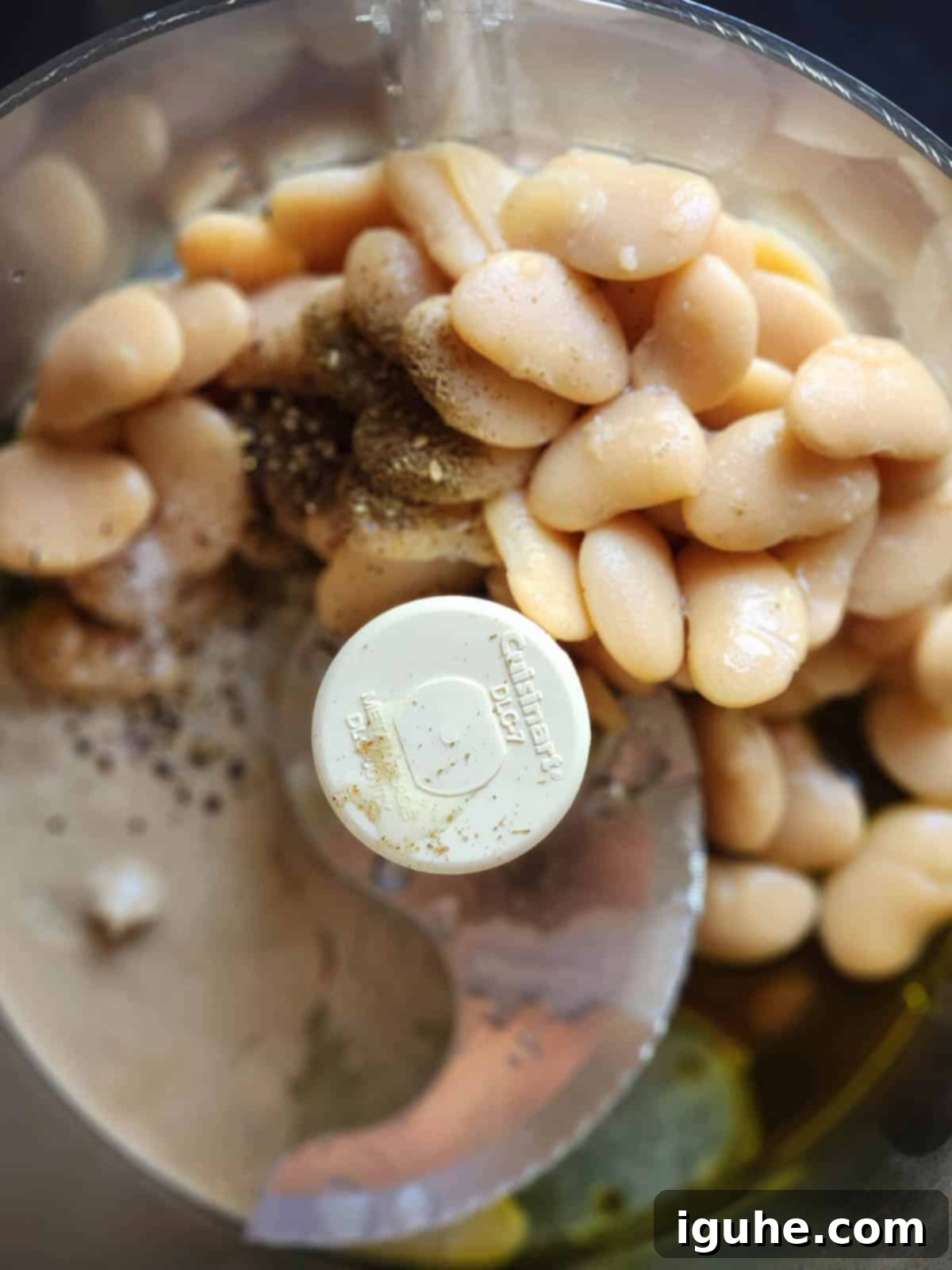Silken Butter Bean Hummus 4 Ingredients for butter bean hummus in a food processor.