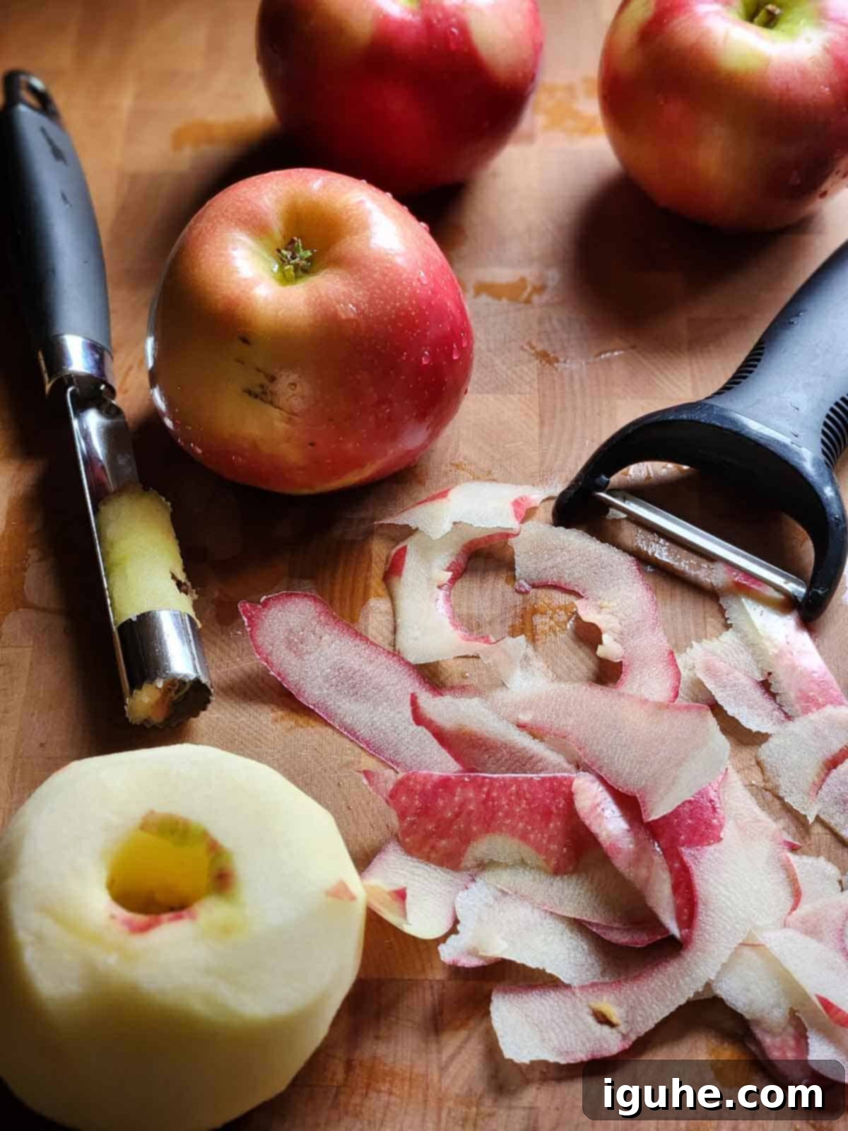 Spiced Honeycrisp Applesauce 4 Peeled and cored apple on a cutting board.