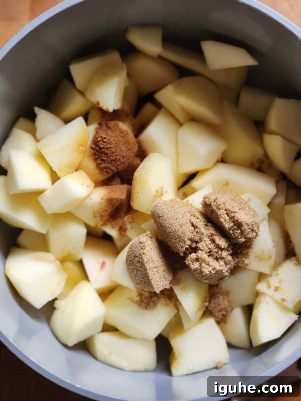 Spiced Honeycrisp Applesauce 6 Ingredients for Honeycrisp applesauce in a pot.