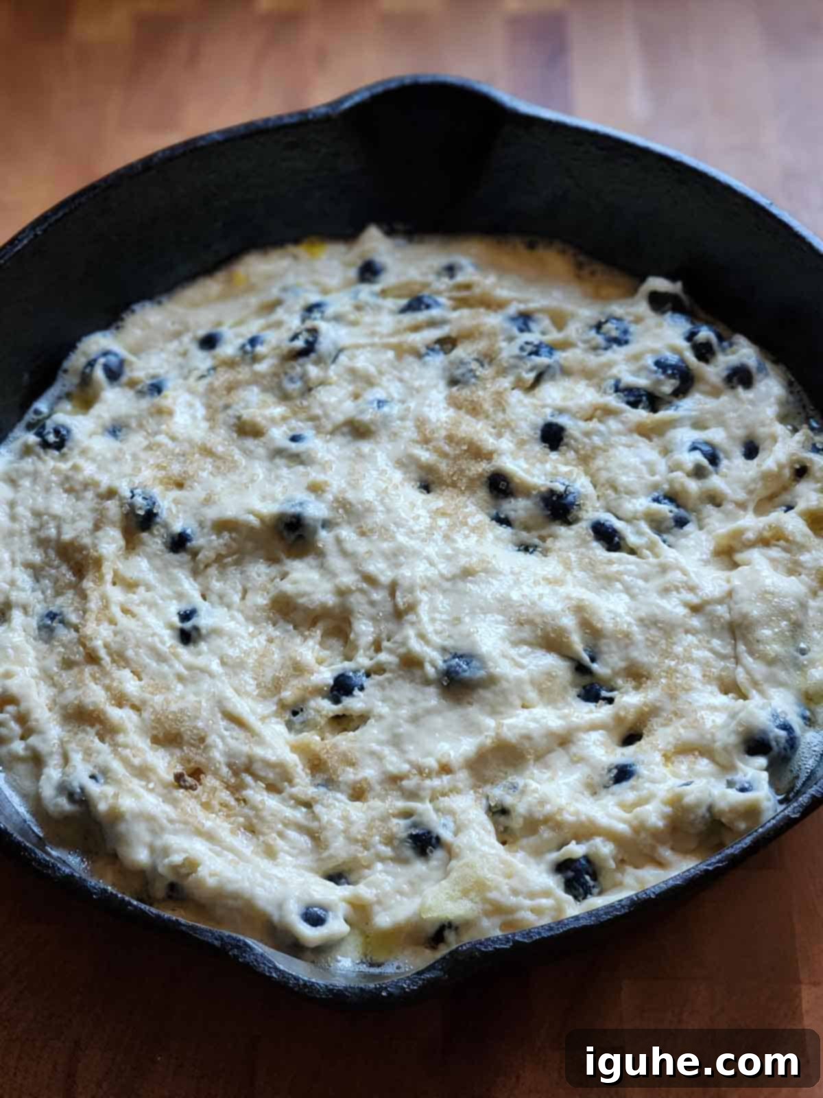 Blueberry Burst Skillet Pancake 9 Pancake batter in a cast iron skillet.