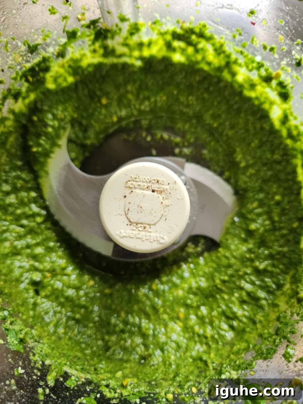 Golden Roasted Garlic Pesto 7 Pesto blended in a food processor.
