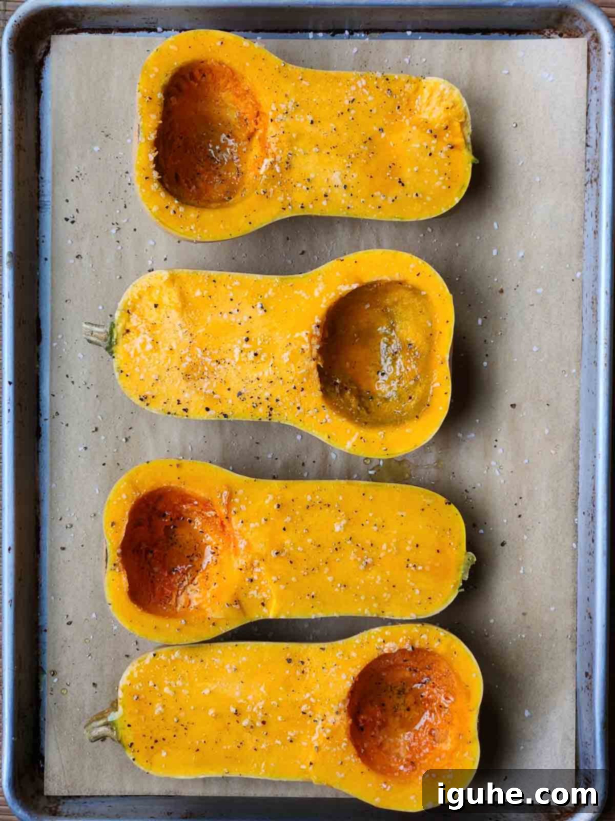 Golden Harvest Squash Soup 3 Squash halves arranged skin side down on a baking sheet, drizzled with olive oil, salt, and pepper.