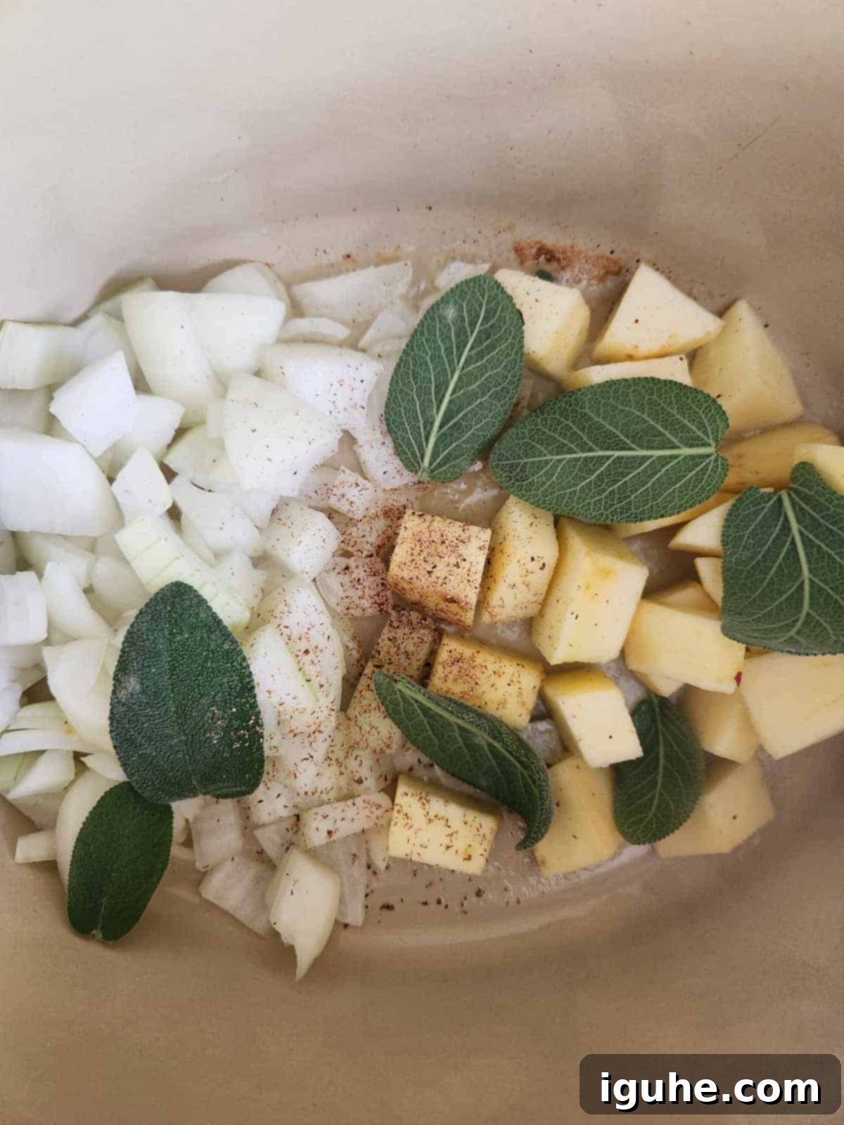Golden Harvest Squash Soup 5 Onions, apples, sage, and nutmeg simmering in butter in a large pot, forming the aromatic base of the soup.