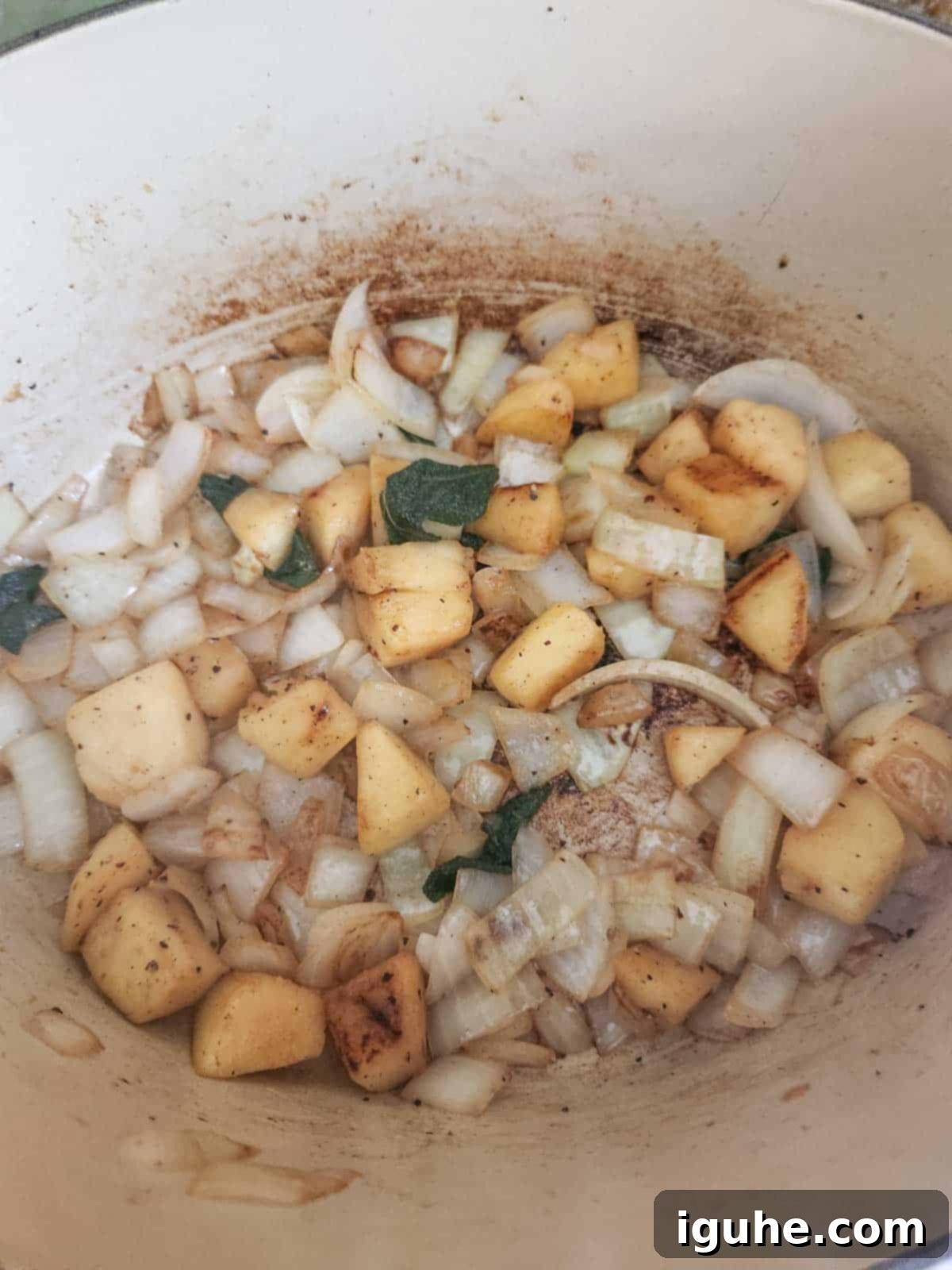 Golden Harvest Squash Soup 6 Sautéed vegetables in a pot for soup, softened and fragrant.