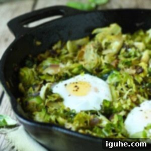 Crispy Sprout Skillet 12 Close-up of Brussel sprout hash in a black skillet.