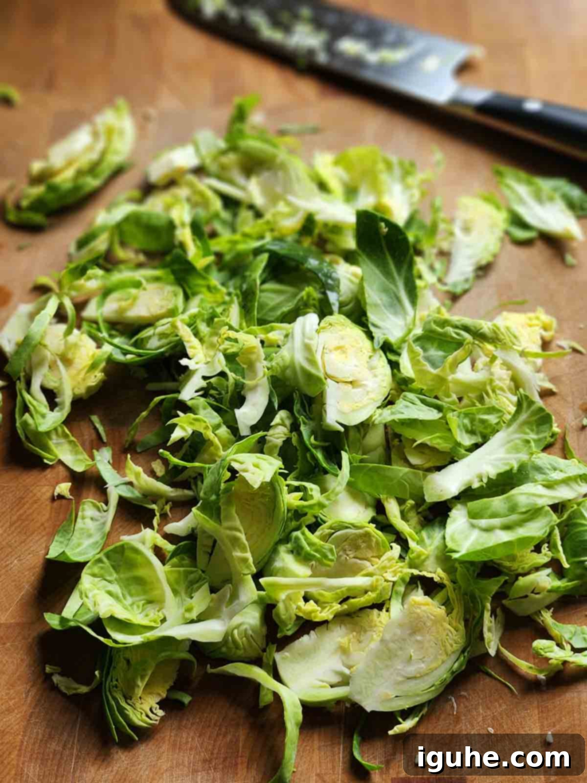 Crispy Sprout Skillet 5 Shredded Brussel sprouts n a cutting board.