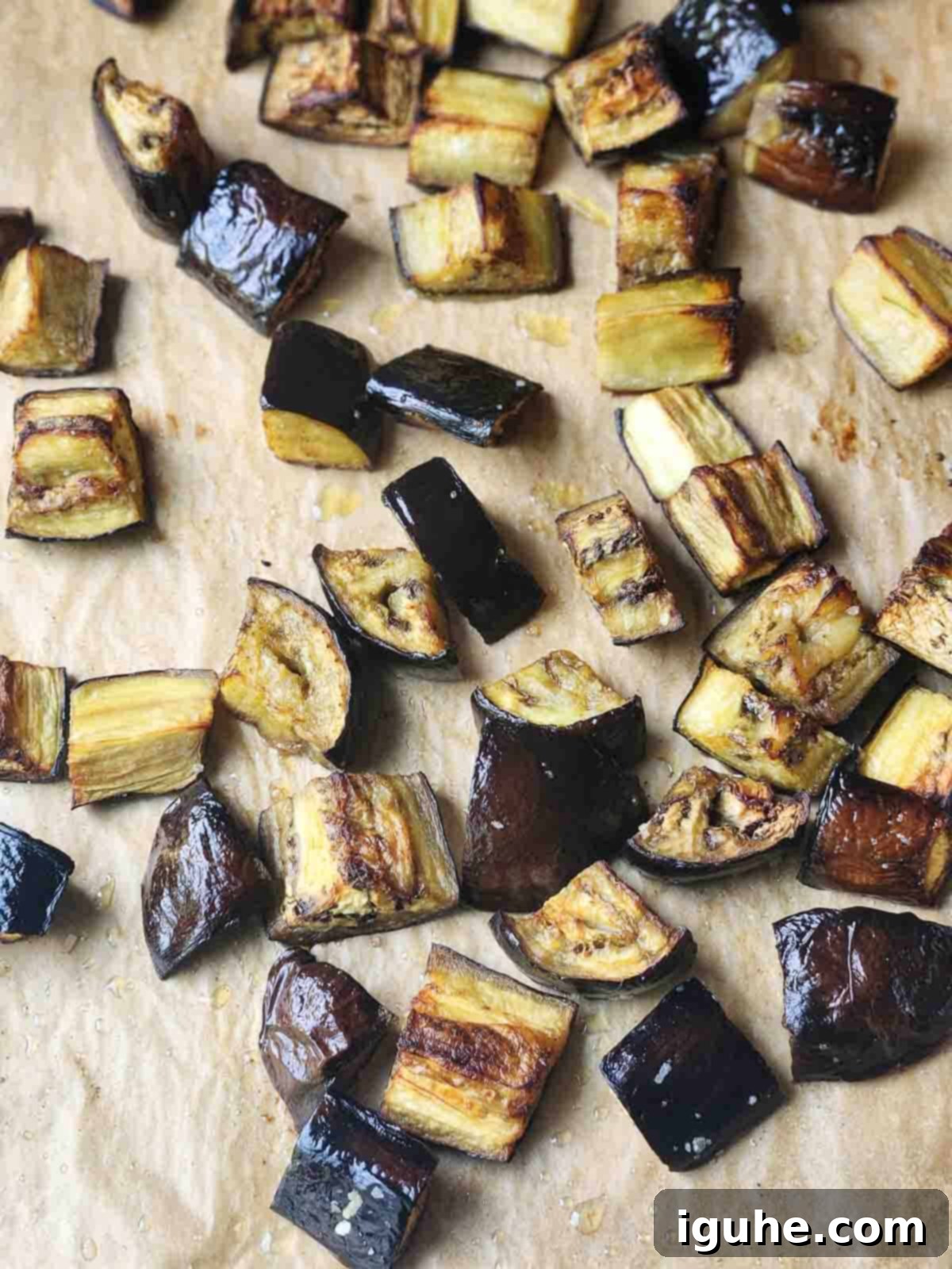 Vibrant Sicilian Eggplant Caponata 5 Roasted eggplant on parchment paper.