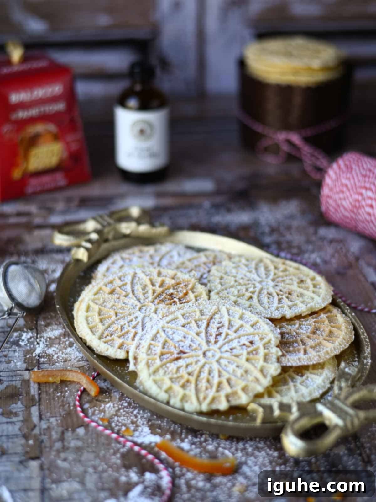 Panettone Pizzelle Treats 5 Pizzelle on an oval platter on a wood surface.