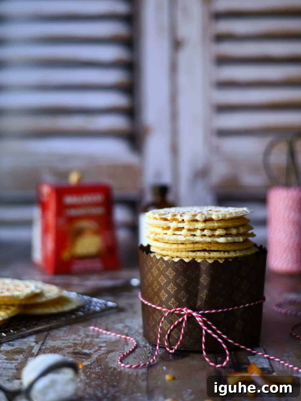Panettone Pizzelle Treats 6 Eye level view of pizzelle in a panettone wrapper.
