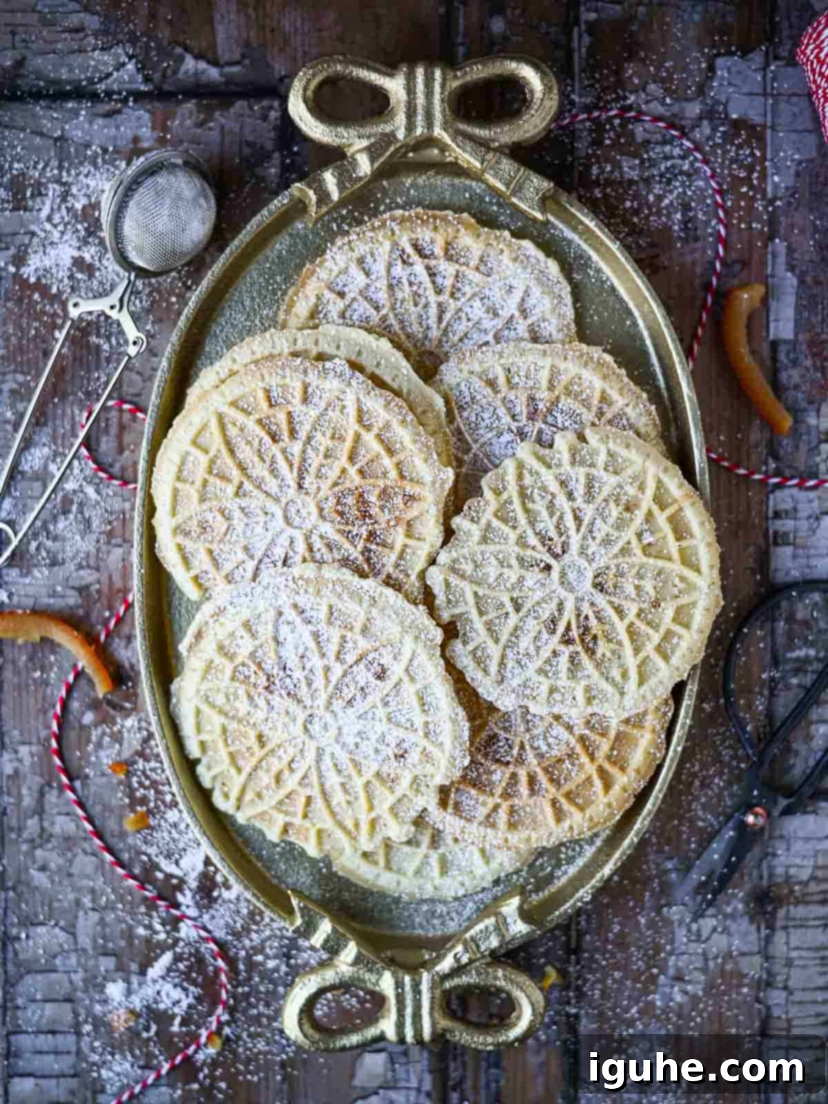 Panettone Pizzelle Treats 7 Overhead of pizzelle cookies on an oval plate with bows.