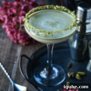 Velvet White Chocolate Pistachio Martini 10 Pistachio martini on a black tray.