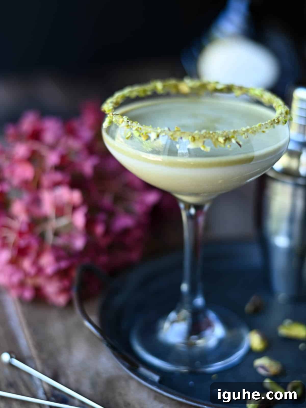 Velvet White Chocolate Pistachio Martini 7 Eye-level view of a pistachio white chocolate martini on a tray.