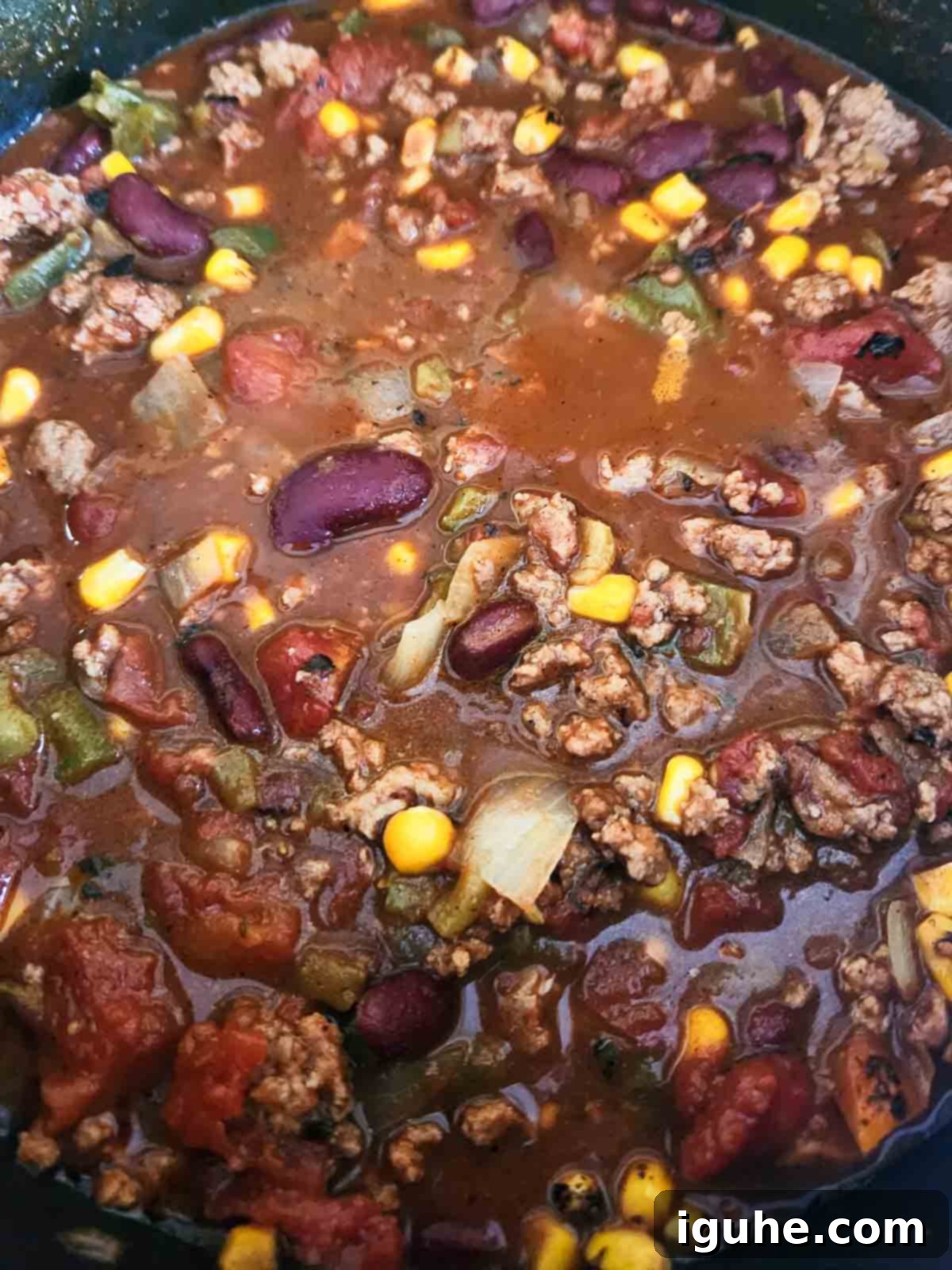 Fire Roasted Turkey Chili 7 Finished fire-roasted chili simmering in a pot.